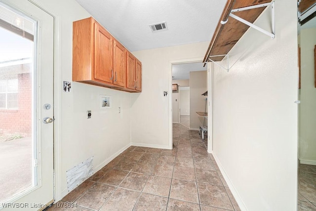 laundry area with cabinets, washer hookup, tile patterned flooring, and electric dryer hookup