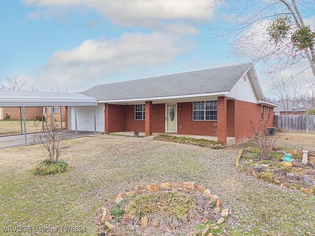 ranch-style house with a garage and a front lawn