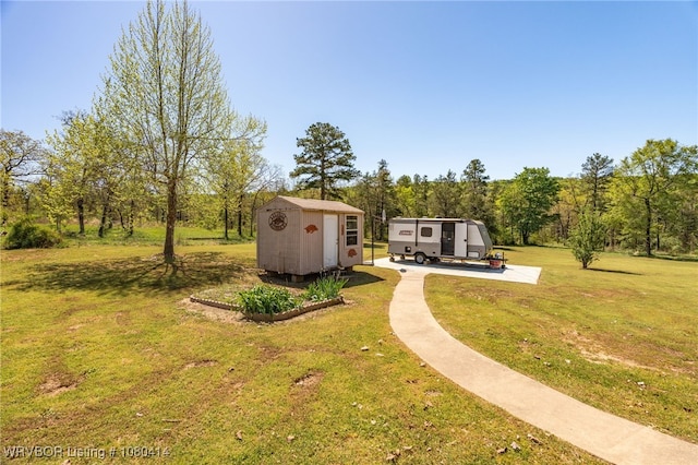 7441 Valley Creek Rd, Cecil, AR 72930 - view of yard featuring an outbuilding and a storage shed
