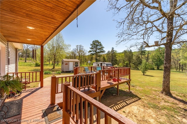 7441 Valley Creek Rd, Cecil, AR 72930 - wooden terrace featuring a lawn, an outdoor structure, and a shed