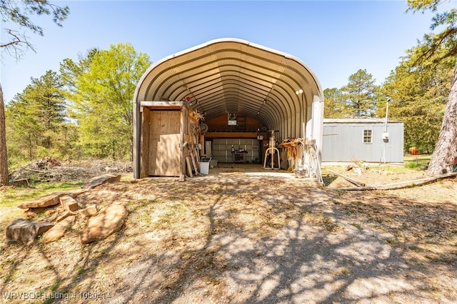 7441 Valley Creek Rd, Cecil, AR 72930 - view of outbuilding with a carport, driveway, and an outdoor structure
