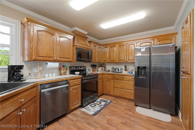 7441 Valley Creek Rd, Cecil, AR 72930 - kitchen featuring light wood finished floors, brown cabinetry, appliances with stainless steel finishes, and crown molding