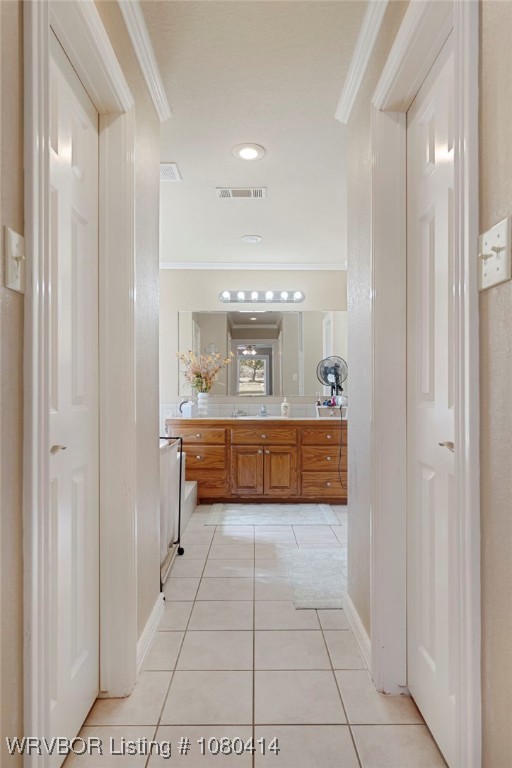 7441 Valley Creek Rd, Cecil, AR 72930 - bathroom with visible vents, tile patterned flooring, vanity, and ornamental molding