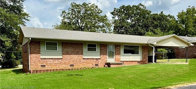 ranch-style house with a front lawn and a carport