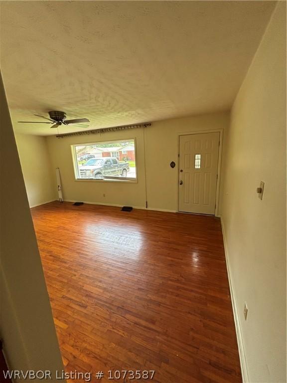 foyer featuring hardwood / wood-style floors and ceiling fan