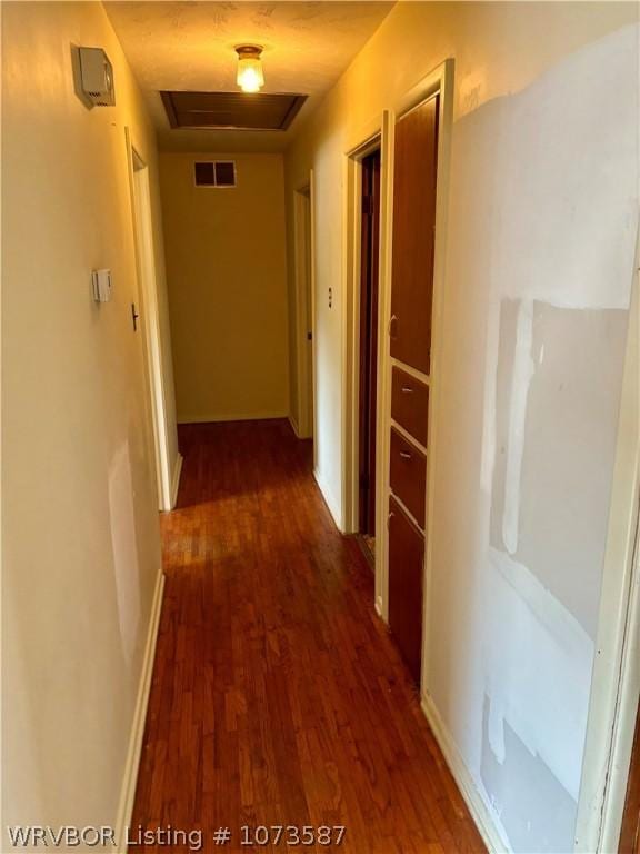 hallway featuring dark wood-type flooring