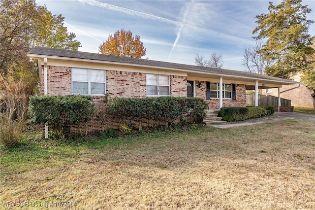 ranch-style house with a porch and a front lawn