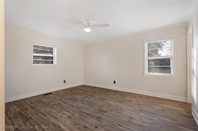 unfurnished room with crown molding, dark hardwood / wood-style flooring, and ceiling fan