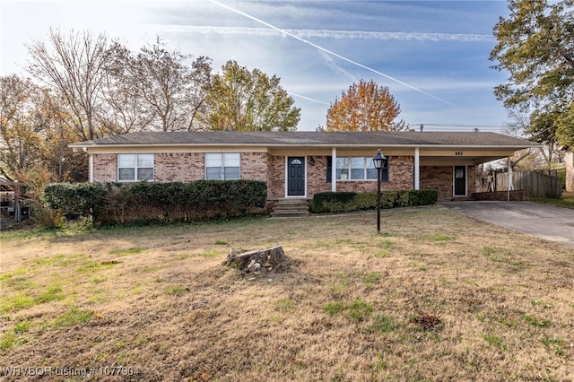 single story home with a front yard and a carport