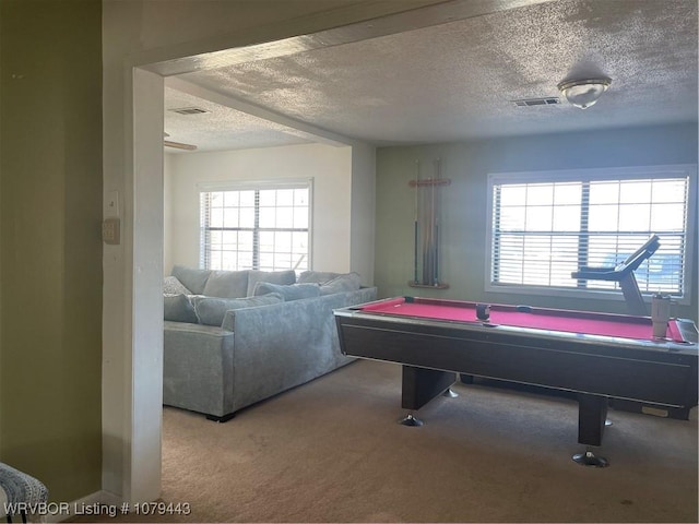 recreation room featuring a textured ceiling, carpet floors, pool table, and visible vents