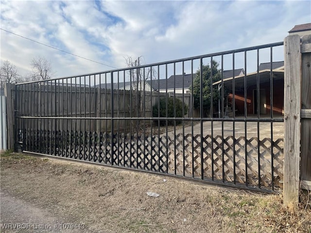 view of gate featuring fence