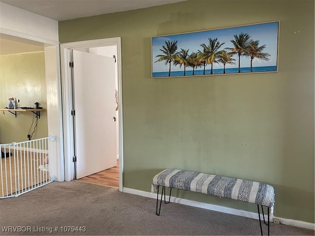 carpeted bedroom featuring baseboards