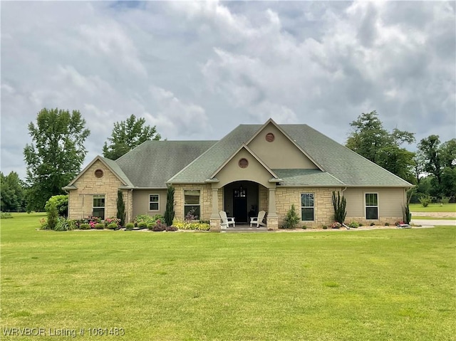 3414 Bugscuffle Rd, Lavaca, AR 72941 - view of front of home featuring stone siding, a front lawn, and roof with shingles