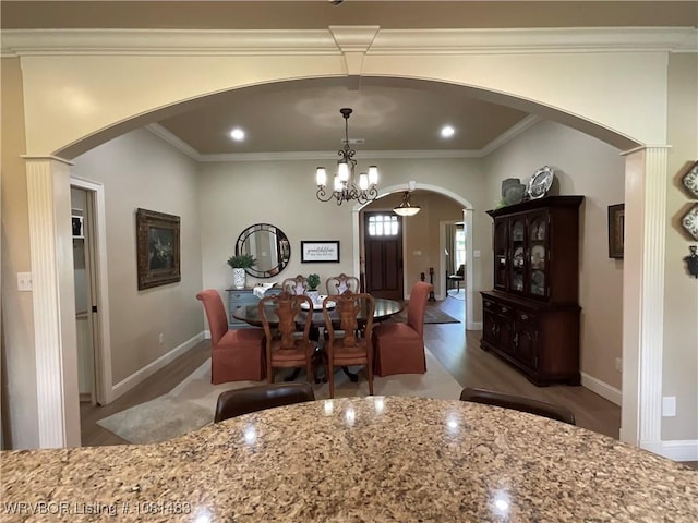 3414 Bugscuffle Rd, Lavaca, AR 72941 - dining room with wood finished floors, arched walkways, a chandelier, and ornamental molding