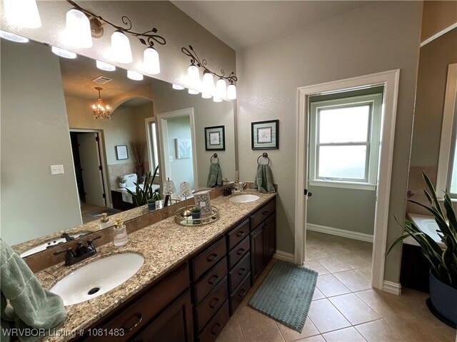 3414 Bugscuffle Rd, Lavaca, AR 72941 - full bath with double vanity and tile patterned flooring
