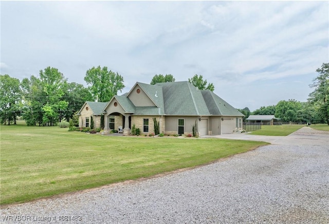 3414 Bugscuffle Rd, Lavaca, AR 72941 - view of front of home featuring driveway, a garage, and a front yard