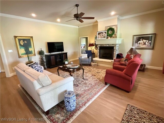 3414 Bugscuffle Rd, Lavaca, AR 72941 - living room with light wood-style floors, a stone fireplace, a ceiling fan, ornamental molding, and recessed lighting