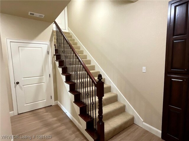 3414 Bugscuffle Rd, Lavaca, AR 72941 - stairway with wood finished floors and baseboards