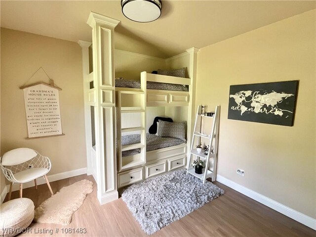 3414 Bugscuffle Rd, Lavaca, AR 72941 - bedroom with wood finished floors and decorative columns