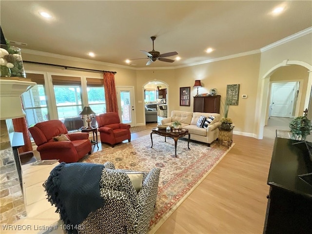 3414 Bugscuffle Rd, Lavaca, AR 72941 - living room with arched walkways, ceiling fan, crown molding, light wood-style flooring, and recessed lighting