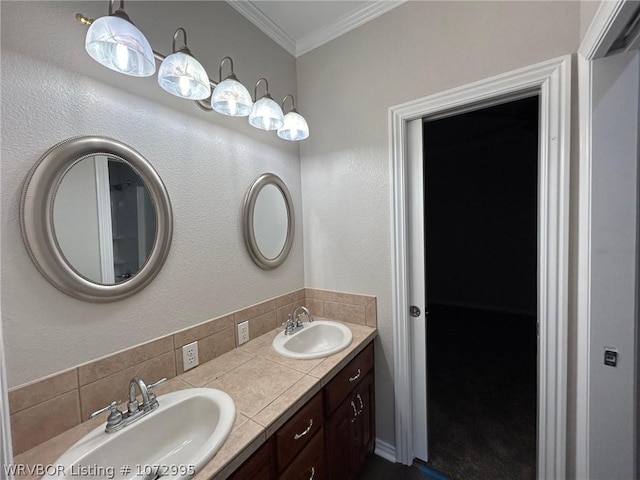 bathroom featuring vanity, crown molding, and tasteful backsplash