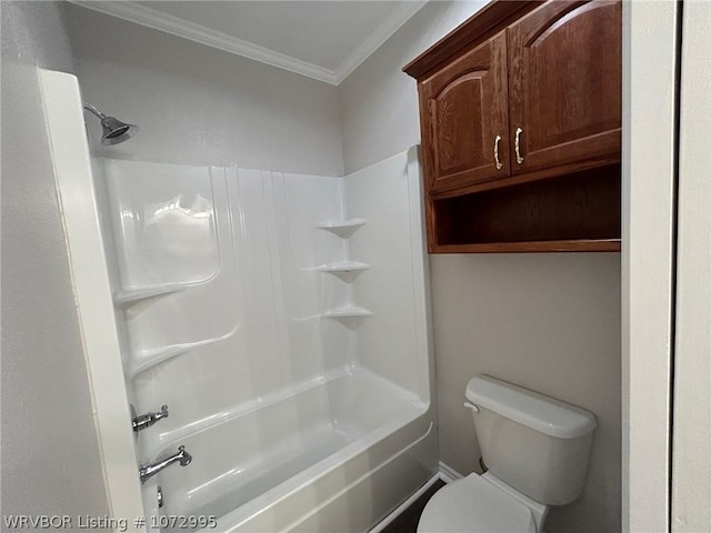 bathroom featuring toilet, ornamental molding, and bathtub / shower combination