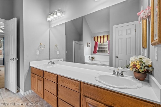 full bath with a garden tub, double vanity, tile patterned flooring, and a sink