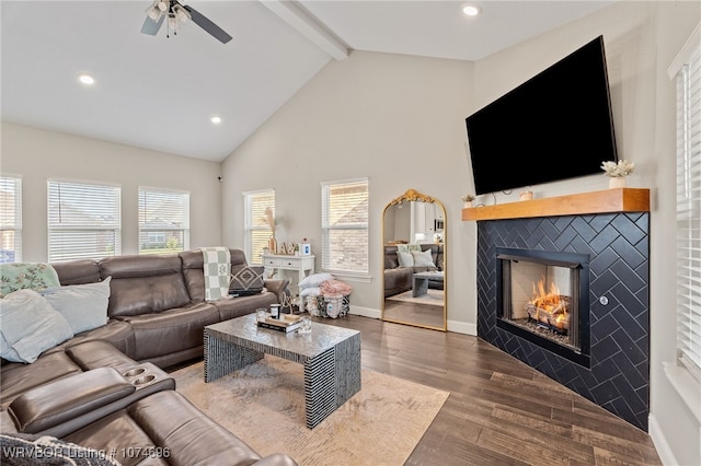 living room with high vaulted ceiling, ceiling fan, a fireplace, beamed ceiling, and dark hardwood / wood-style flooring