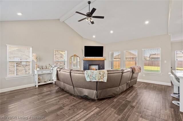 living room featuring beam ceiling, ceiling fan, and high vaulted ceiling