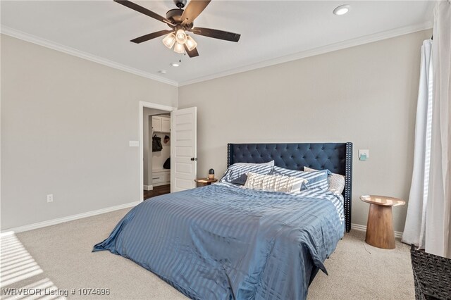 bedroom with carpet, ceiling fan, and ornamental molding