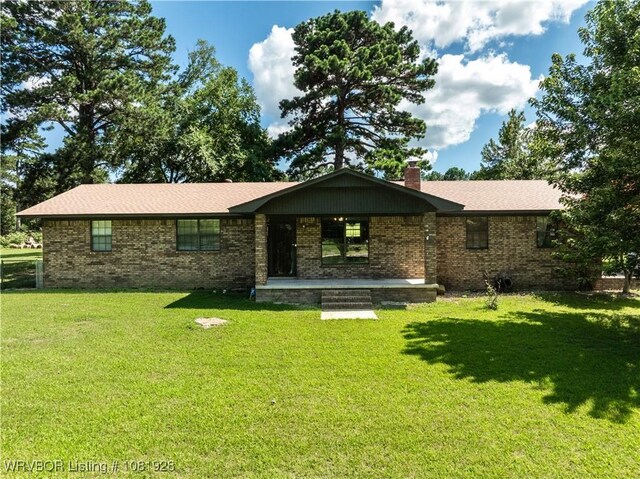 1141 Mountain Grove Ter, Alma, AR 72921 - view of front facade featuring brick siding, a front yard, and a chimney