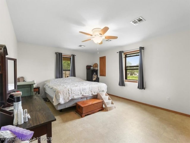 34590 Latam Ridge Rd, Shady Point, OK 74956 - bedroom featuring a ceiling fan, baseboards, and light floors