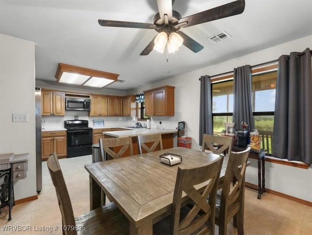 34590 Latam Ridge Rd, Shady Point, OK 74956 - dining area featuring baseboards, a ceiling fan, and light tile patterned floors
