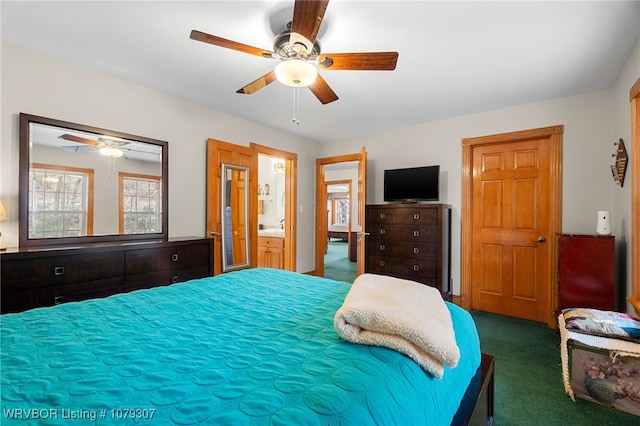 bedroom with ensuite bath, a ceiling fan, and carpet flooring