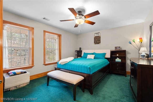 bedroom with carpet floors, baseboards, visible vents, and ceiling fan