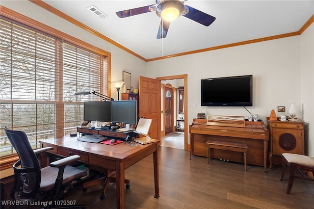 office with wood finished floors, visible vents, and crown molding