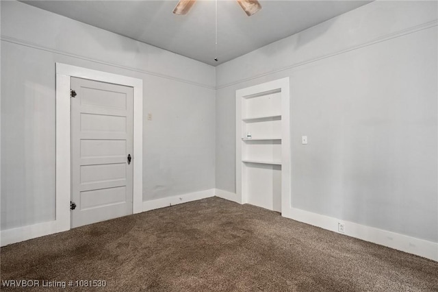 701 Witte St, Poteau, OK 74953 - spare room featuring dark colored carpet and ceiling fan