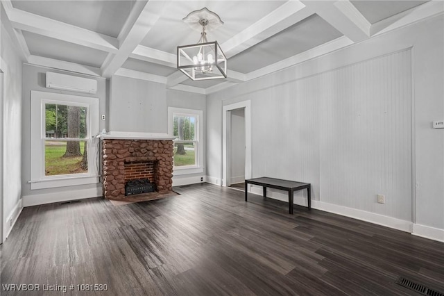701 Witte St, Poteau, OK 74953 - unfurnished living room with coffered ceiling, a wall unit AC, a chandelier, a fireplace, and dark wood-style flooring