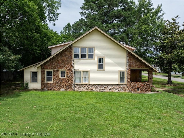 701 Witte St, Poteau, OK 74953 - view of side of home featuring stone siding and a lawn
