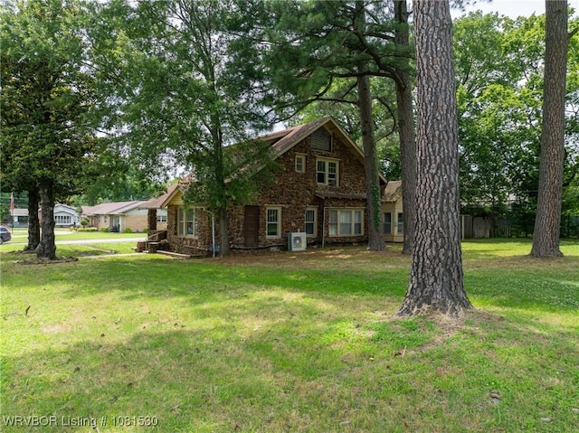 701 Witte St, Poteau, OK 74953 - view of front facade featuring stone siding and a front yard