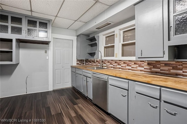 701 Witte St, Poteau, OK 74953 - kitchen featuring stainless steel dishwasher, open shelves, butcher block countertops, gray cabinetry, and tasteful backsplash