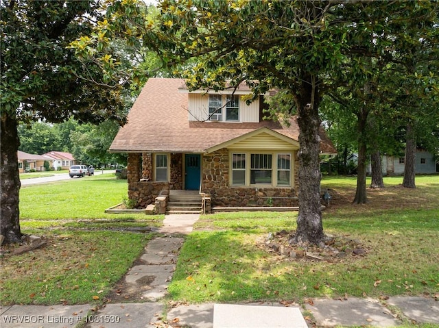701 Witte St, Poteau, OK 74953 - view of front facade featuring stone siding, a front yard, and a shingled roof