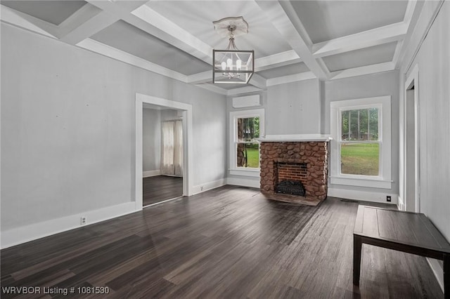701 Witte St, Poteau, OK 74953 - unfurnished living room featuring coffered ceiling, a chandelier, a fireplace, beamed ceiling, and wood finished floors