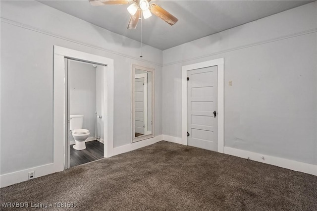 701 Witte St, Poteau, OK 74953 - unfurnished bedroom featuring dark colored carpet, ensuite bathroom, and a ceiling fan