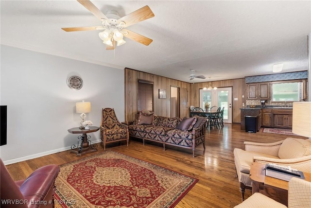 2219 N 55th Ln, Fort Smith, AR 72904 - living area with ceiling fan, baseboards, and wood finished floors