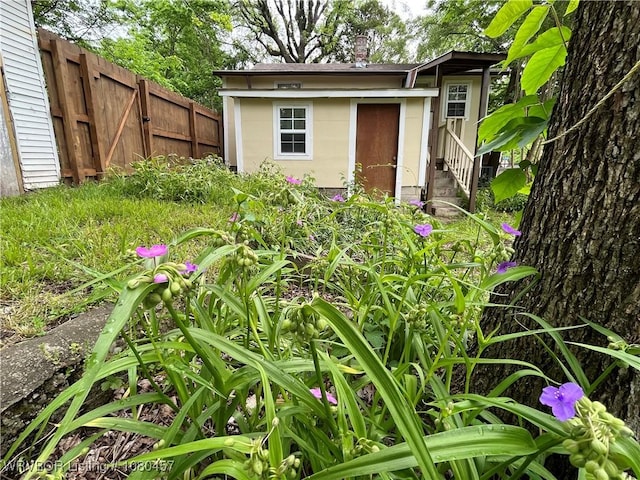 exterior space with fence and an outdoor structure