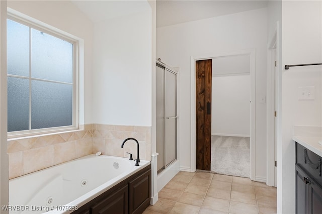 full bath with tile patterned flooring, a shower stall, a tub with jets, and vanity