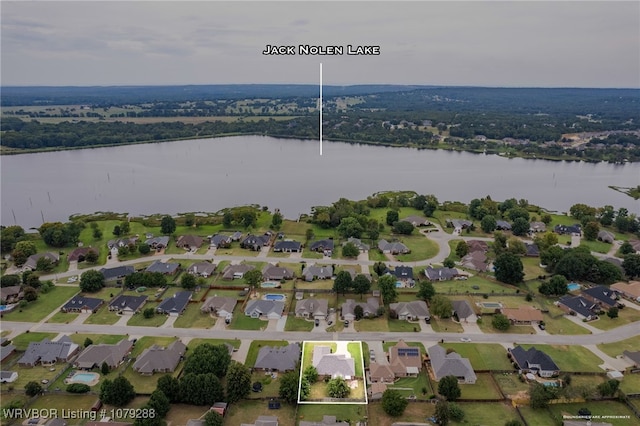 drone / aerial view with a residential view and a water view