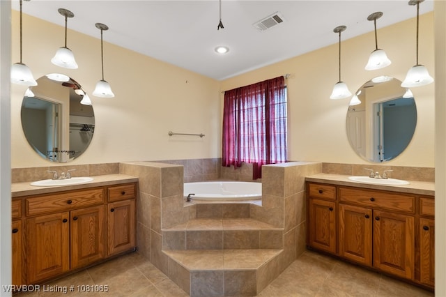 2117 Parkway Cir, Van Buren, AR 72956 - full bathroom featuring tile patterned flooring, two vanities, and a garden tub