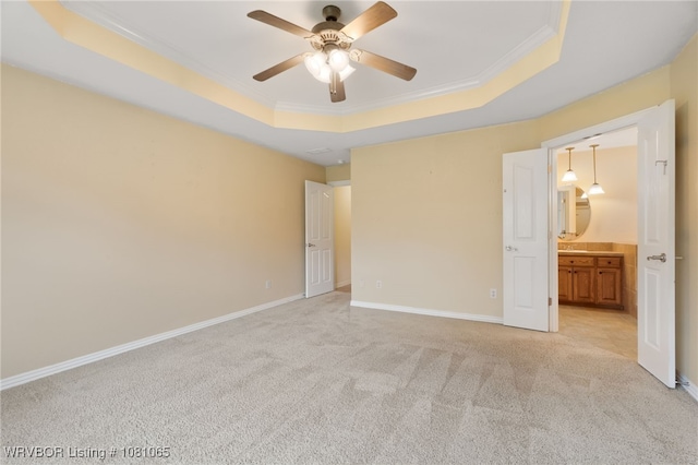 2117 Parkway Cir, Van Buren, AR 72956 - unfurnished bedroom featuring a raised ceiling, light colored carpet, ornamental molding, baseboards, and ensuite bath